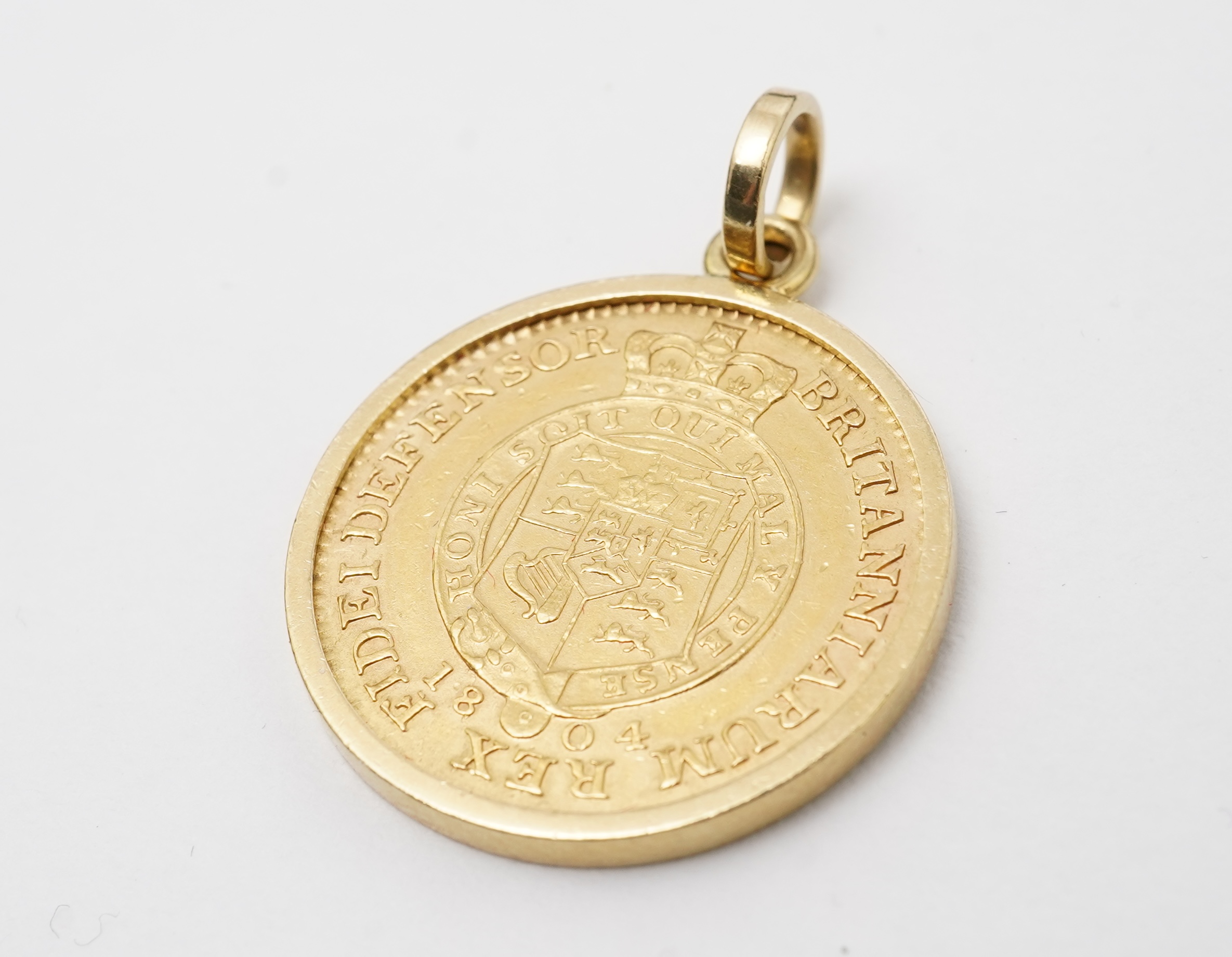 A George III half guinea pendant, circa 1804 and later